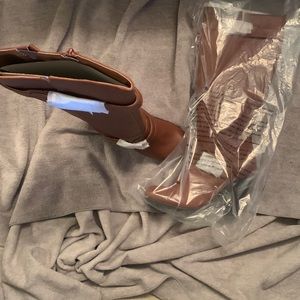 Brown boots size 7 up to the knee.